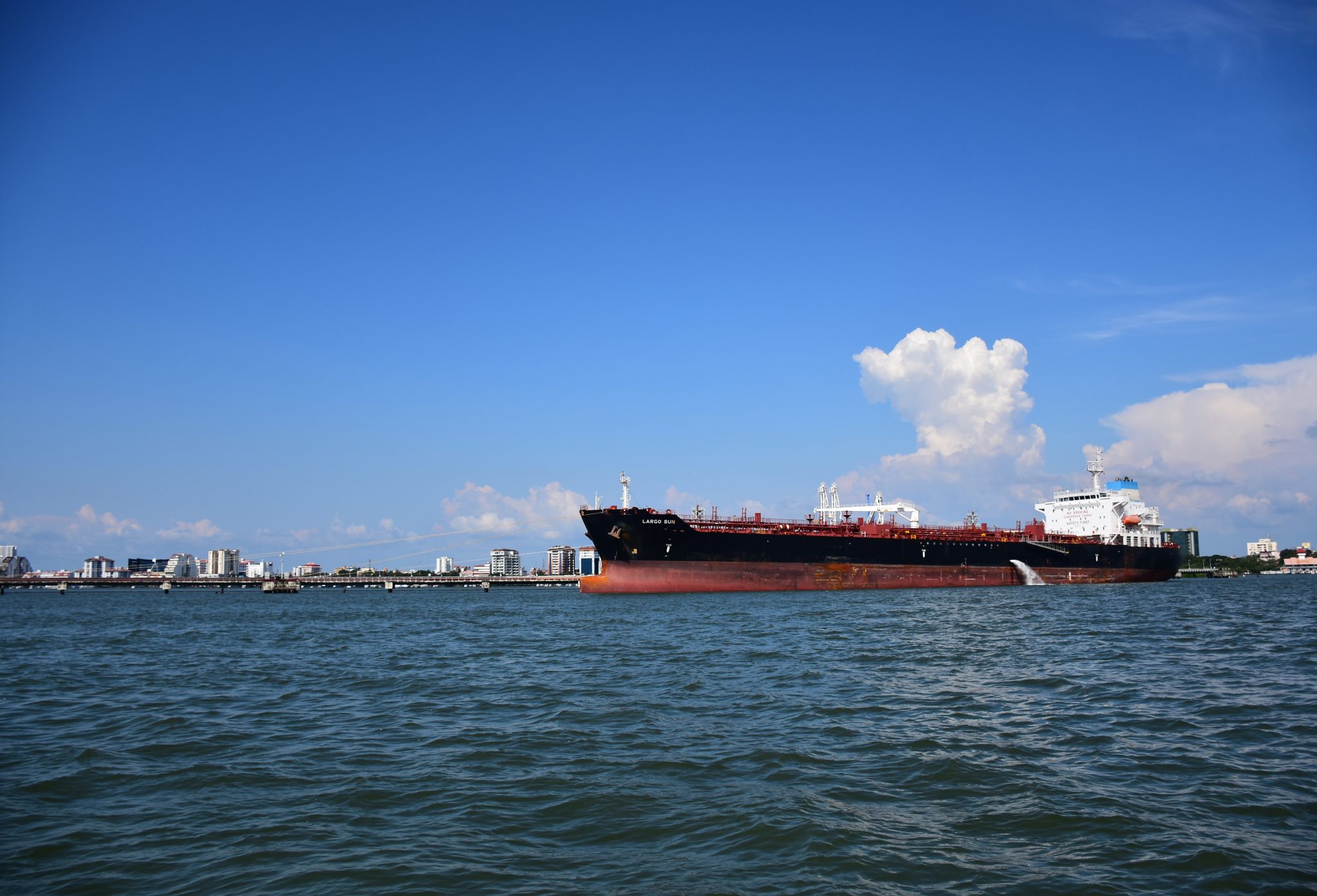 Oil tanker at sea under an overcast sky